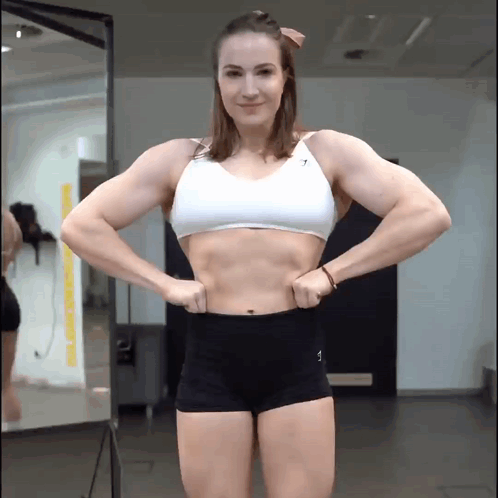 Woman in White Top and Black Shorts