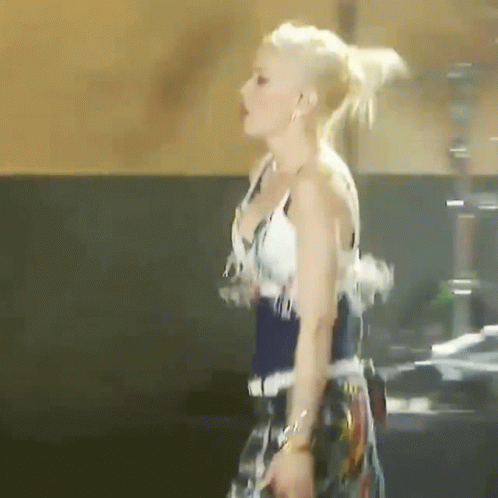 Woman in White Top and Blue Skirt