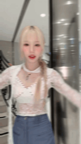 Woman In White Top Blue Pants At Glass Door GIF