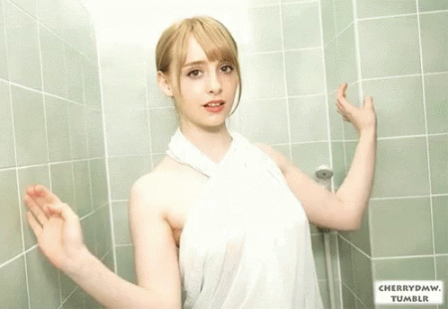 Woman in White Towel Leaning Against Green Tiled Wall With cherrydmw tumblr