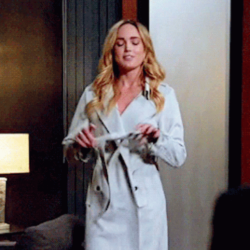 Woman In White Trench Coat GIF