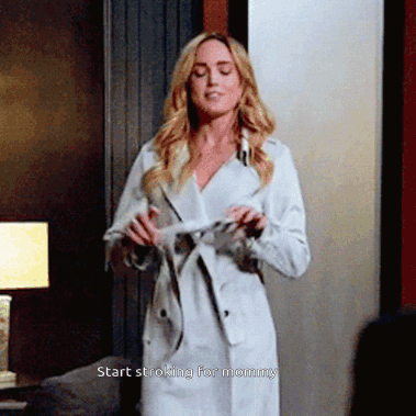 Woman In White Trench Coat Saying Start Stroking For Mommy GIF