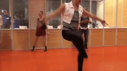 Woman In White Vest And Black Pants Dancing GIF