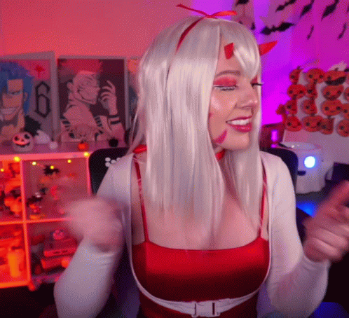 Woman In White Wig And Red Top Smiling GIF