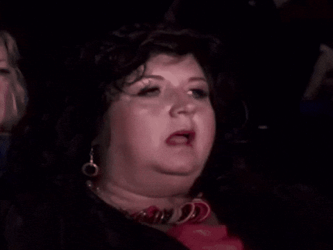 Woman in Wig and Earrings Making Funny Face