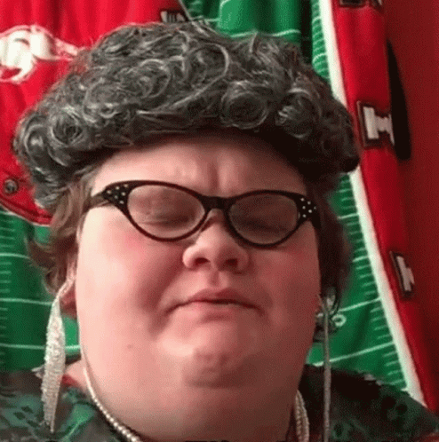 Woman in Wig and Glasses Making Funny Face