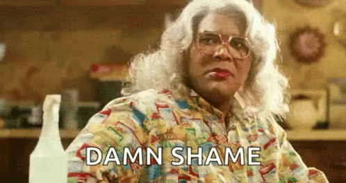 Woman In Wig And Glasses Saying Damn Shame GIF