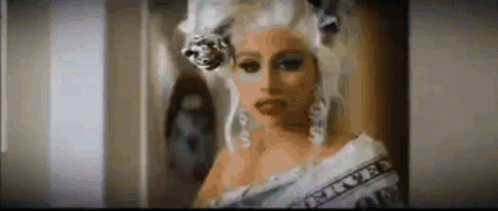 Woman In Wig Holding Money GIF