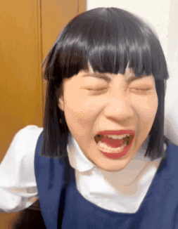 Woman In Wig Making Funny Face GIF