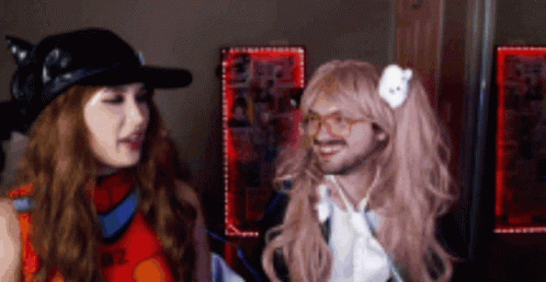 Woman in Wig Next to Man