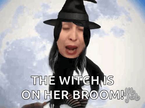 Woman In Witch Costume Flying On Broom GIF