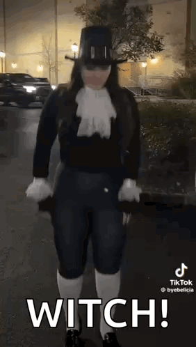 Woman In Witch Costume Holding Umbrella GIF