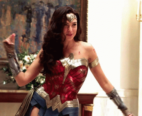 Woman in Wonder Woman Costume in Front of Painting