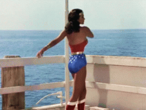 Woman in Wonder Woman Costume Overlooking Ocean