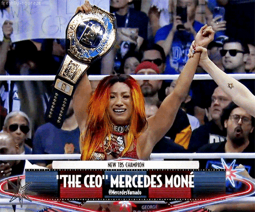 Woman in Wrestling Ring Holding Championship Belt The CEO Mercedes Moné