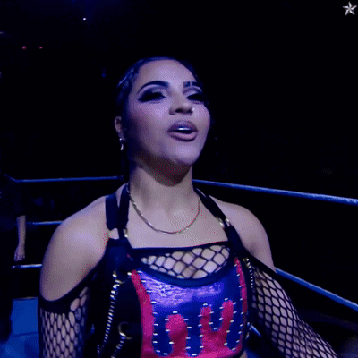 Woman in Wrestling Ring Wearing UFC Shirt