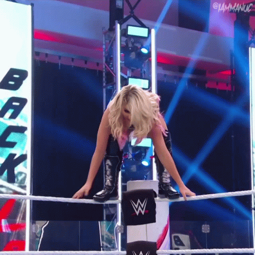 Woman in Wrestling Ring With Back