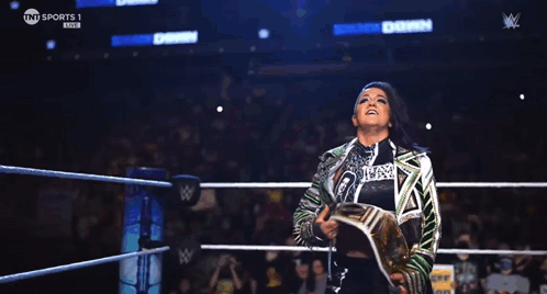 Woman in Wrestling Ring With Hungry Section Sign