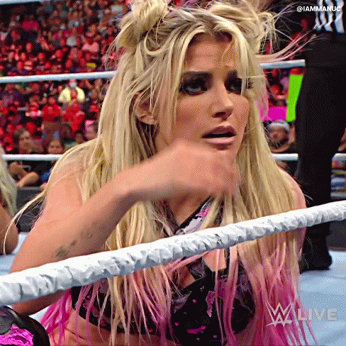 Woman In Wrestling Ring With Iammaniac Sign GIF