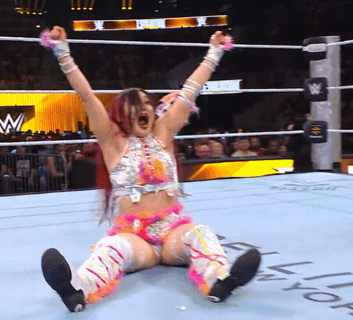 Woman in Wrestling Ring With Letter W