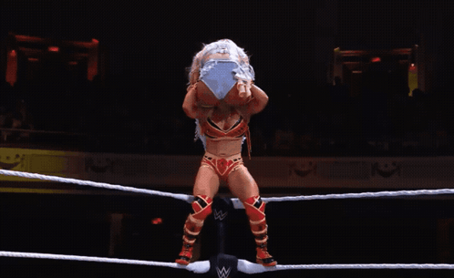 Woman in Wrestling Ring With Letter W