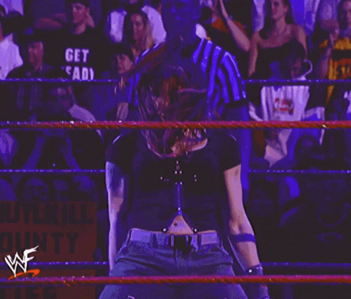 Woman in Wrestling Ring with lkill Sign