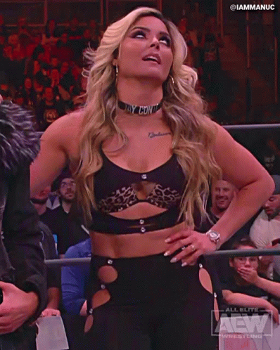 Woman in Wrestling Ring with Logo