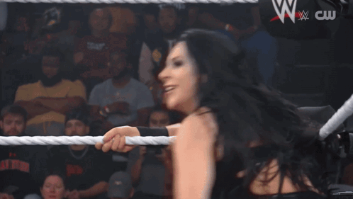 Woman in Wrestling Ring with NXT Sign