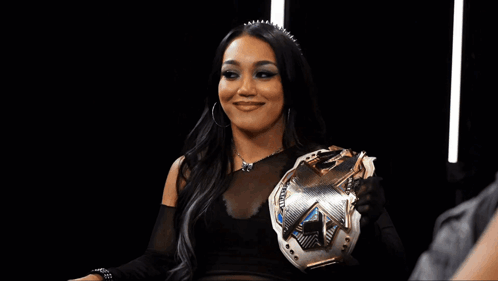 Woman in Wrestling Ring with NXT Sign