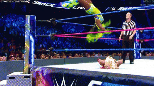 Woman in Wrestling Ring With Smack on Back