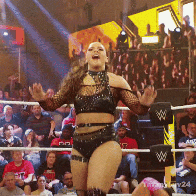 Woman in Wrestling Ring with W on Post