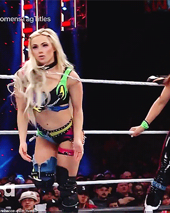 Woman in Wrestling Ring With Womenstag Titles