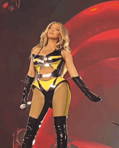 Woman in Yellow and Black Holding Microphone
