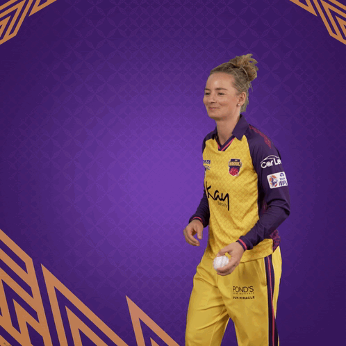 Woman in Yellow and Purple Jersey Saying Kay