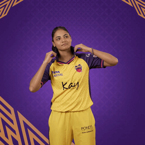 Woman in Yellow and Purple Shirt Saying Kay