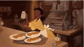 Woman In Yellow Apron Serving Food GIF
