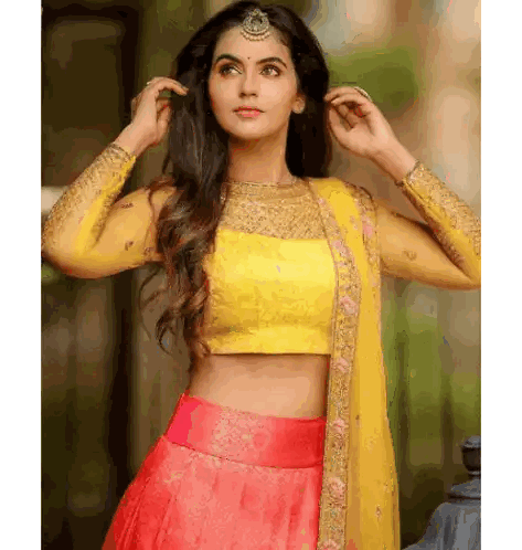Woman in Yellow Crop Top and Pink Skirt