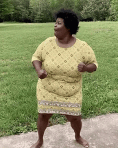 Woman in Yellow Dress Dancing