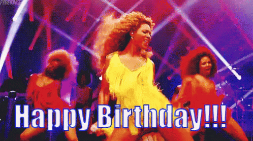 Woman in Yellow Dress Dancing on Stage Saying Happy Birthday