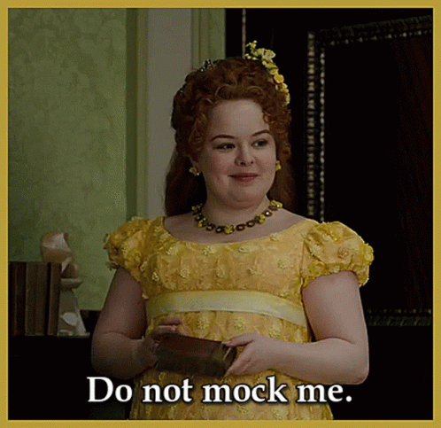 Woman In Yellow Dress Holding Book Says Do Not Mock Me GIF