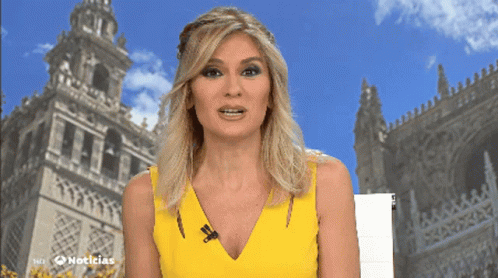 Woman In Yellow Dress In Front Of Noticias Building GIF