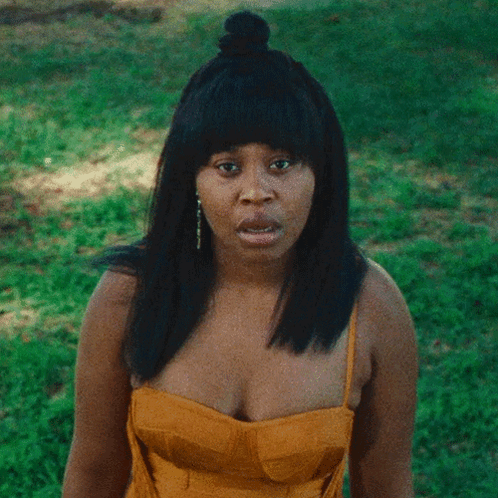 Woman In Yellow Dress Making Funny Face GIF