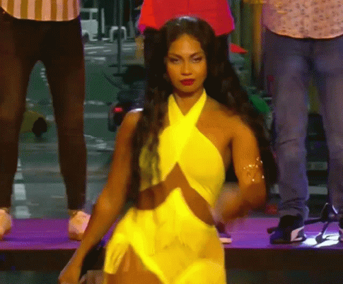 Woman in Yellow Dress on Stage