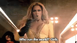 Woman In Yellow Dress Says Who Run The World Girls GIF