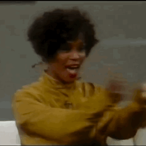 Woman In Yellow Jacket Applauding GIF