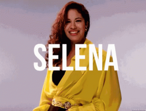 Woman in Yellow Jacket Smiling With Selena
