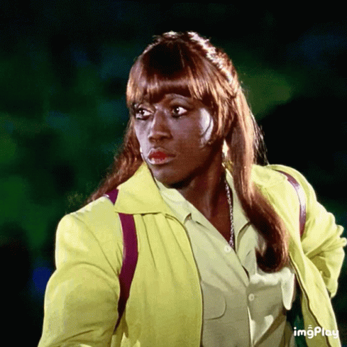 Woman In Yellow Jacket With Word Imgplay GIF