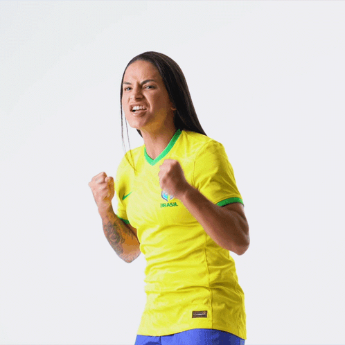 Woman in Yellow Jersey Saying Brasil