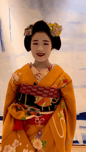 Woman In Yellow Kimono With S On Belt GIF