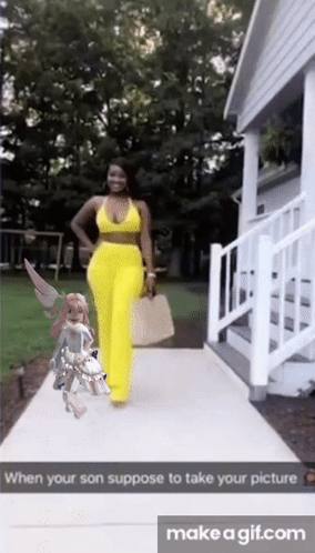 Woman in Yellow Pants Walking Sidewalk